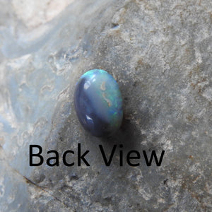Lightning Ridge Solid Black Opal with Green Blue Yellow Colors.