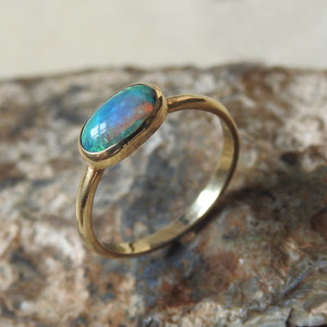 Solid Lightning Ridge Black Crystal Opal Ring with Green Blue Colors