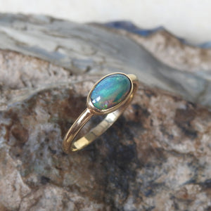 Solid Lightning Ridge Black Crystal Opal Ring with Green Blue Colors